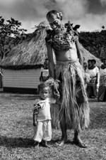 Young Fijian child with the village Chief